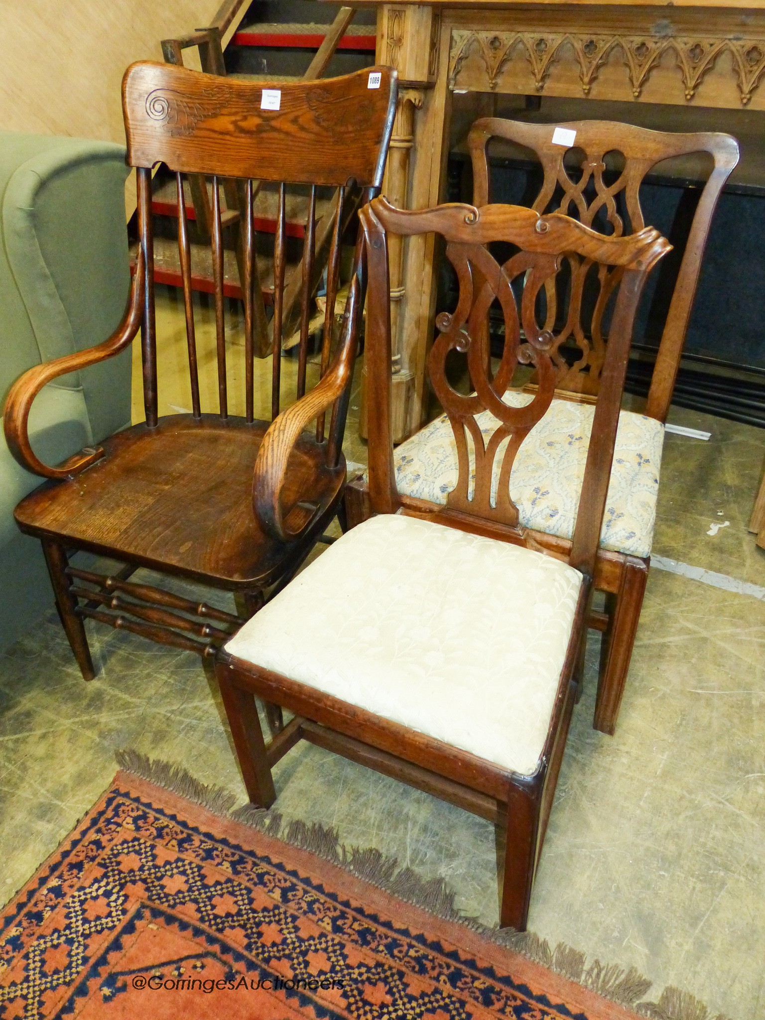 A late Victorian ash and elm stick back elbow chair and two country Chippendale mahogany dining chairs (3)